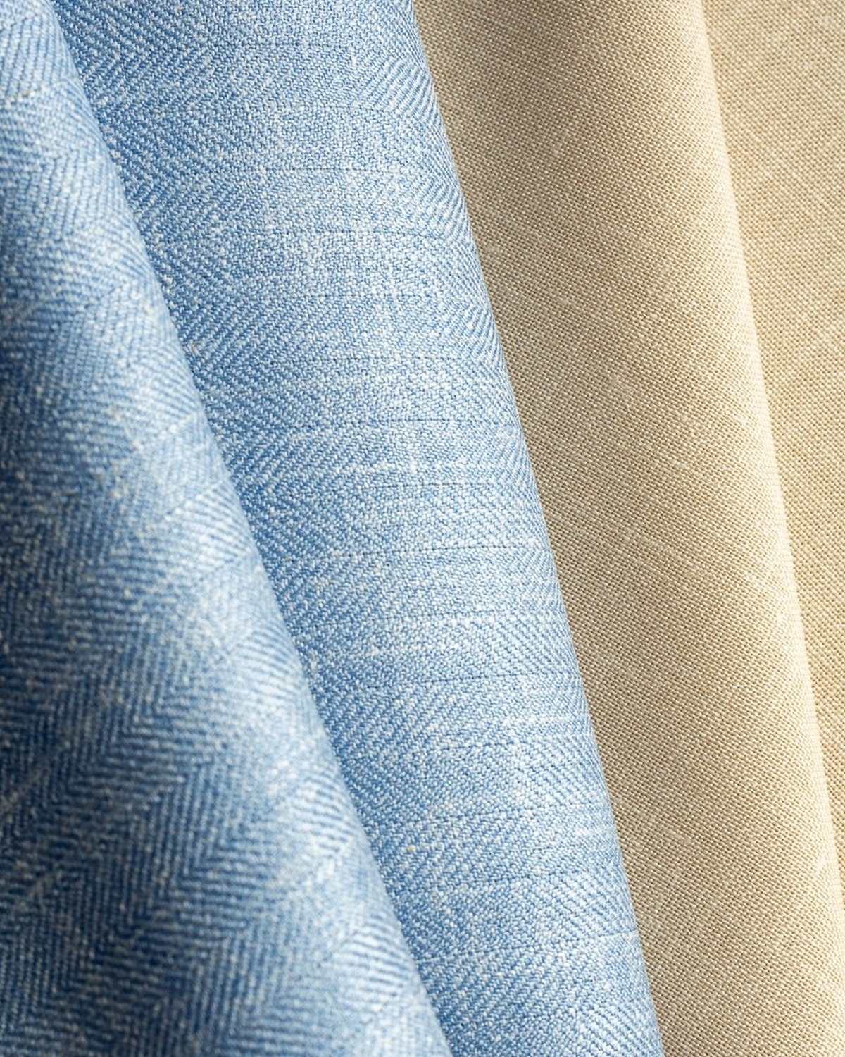 Blue and natural cloths showing distinct weave, texture, and drape