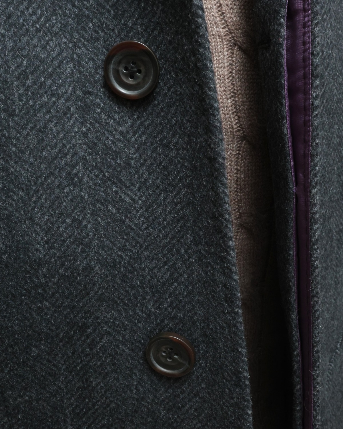 P.GÓRNE garment detail with horn buttons and internal finishing