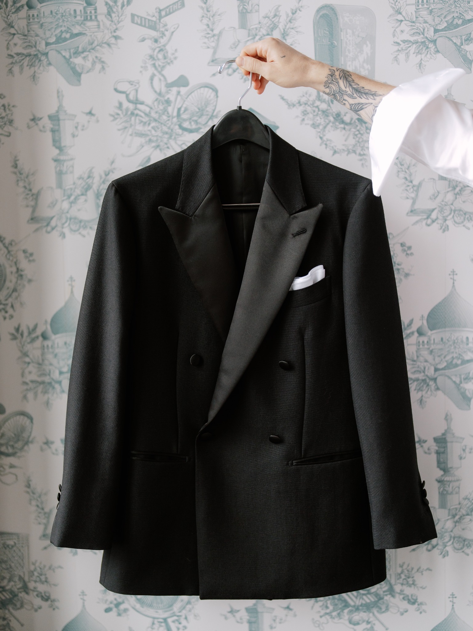 Double-breasted tuxedo hanging before an evening event
