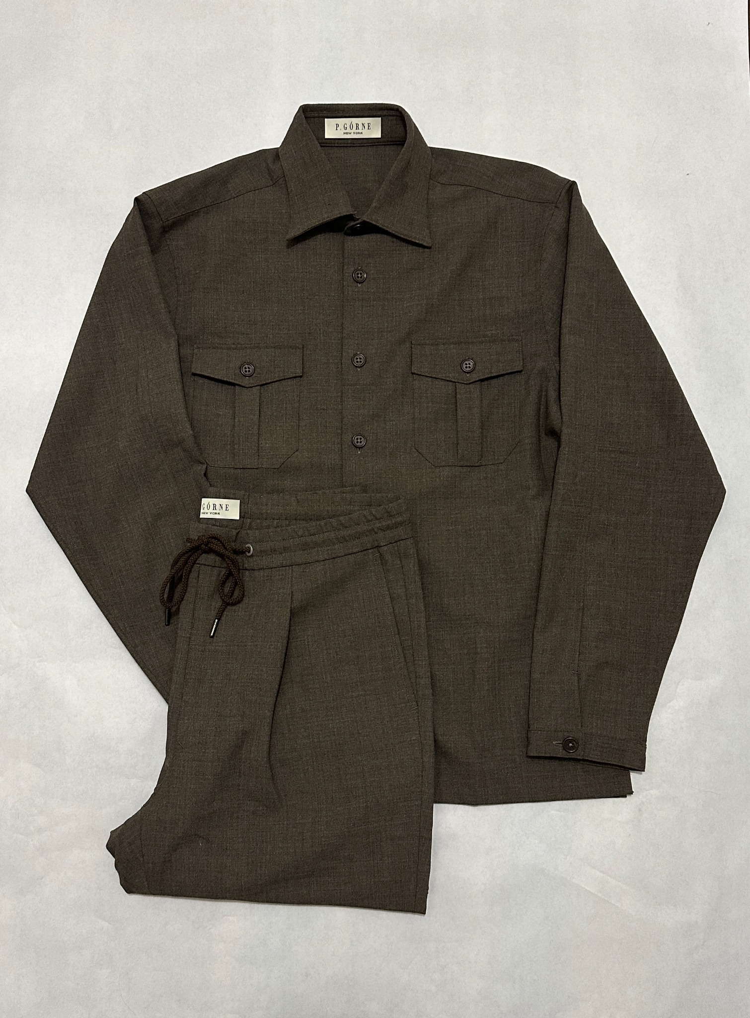 Brown tailored sport coat styled with a striped shirt